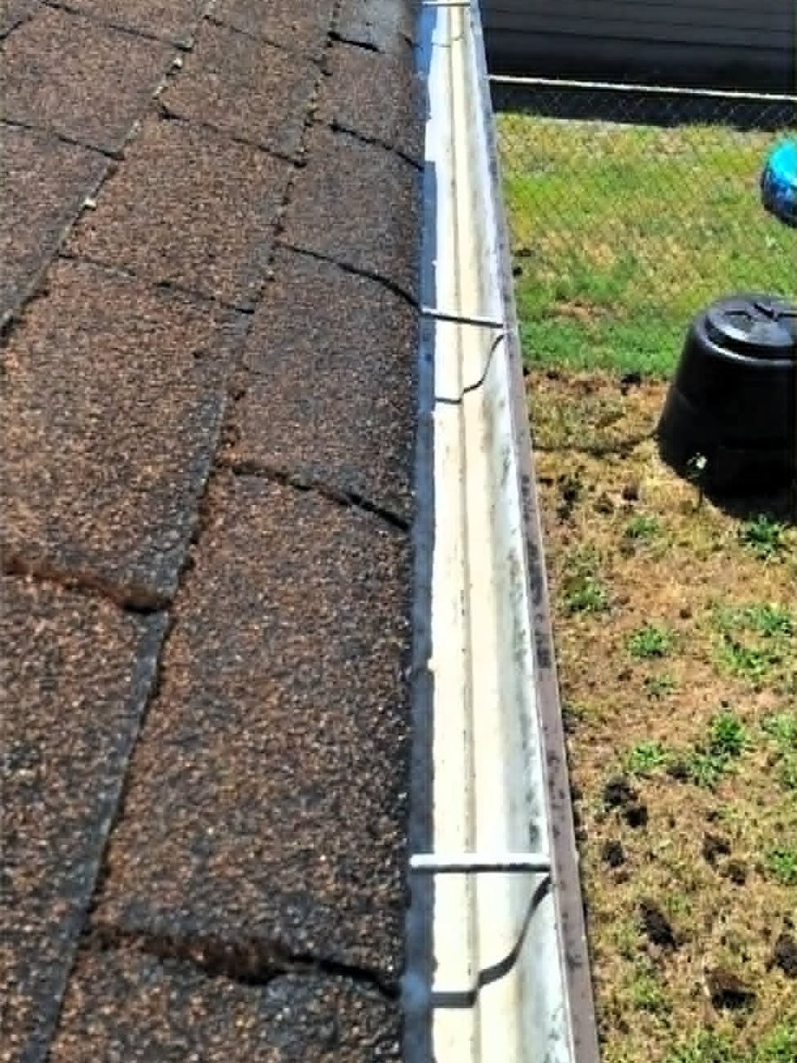 The gutter after cleaning, with the grit and standing water gone